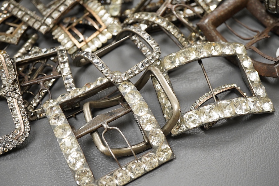 A large collection of shoe buckles, 18th-19th century, of rectangular outline, set with pastes, mostly mounted in steel, a minority in silver, some with later brooch fittings
